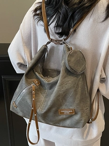 Versatile grey canvas and brown leather tote bag with a retro urban fashion design