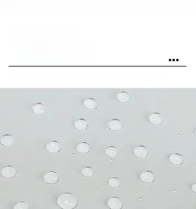 Macro shot of waterproof gray nylon fabric with water droplets on high-density tote bag