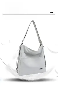 Detail showing the lightweight grey tote bag with a front pocket and soft fabric texture