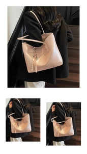 Detailed view of pink tote bag with textured faux leather and floral scarf accessory