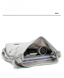 Detailed internal view of grey large tote bag showing laptop and magazine storage space