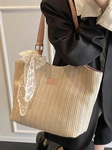 Large straw tote bag with pink leather straps and white lace ribbon for summer fashion