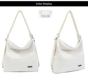 Close-up of cream canvas tote bag showing the MACHUGE label and metal strap buckle
