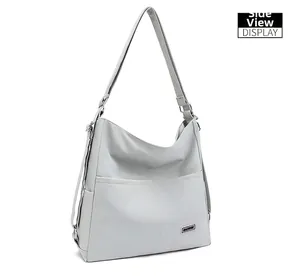 Side view detail of a minimalist light gray tote bag with adjustable shoulder strap