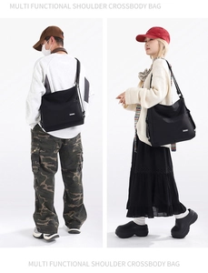 Versatile black minimalist large capacity tote bag shown on male and female models