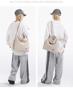 Close-up of beige nylon multi-functional bag showing side pocket and shoulder straps