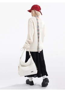 Large white canvas tote bag with front pocket and shoulder strap for daily commuting