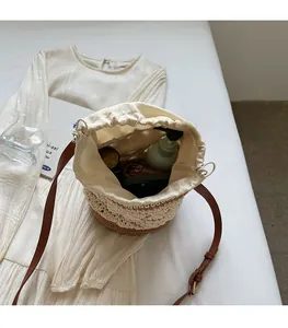 Internal view of bohemian woven bucket bag showing spacious storage and drawstring liner