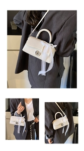 Detailed macro view of the cream white PU leather square bag with pearl and lace decor