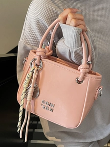 Schicke rosa PU-Leder Eimertasche mit Knotengriff und Metallbuchstaben für Damen