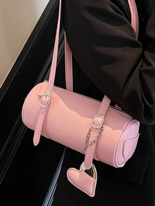 Pink oily leather barrel bag with silver chain and heart charm for casual street style