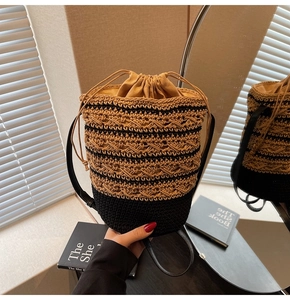 Detail view of woven bucket bag with drawstring closure and striped texture
