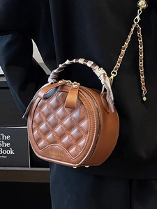 Brown quilted round handbag with silk scarf handle and elegant gold chain strap
