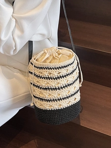 Bohemian crochet bucket bag with hollow weave, drawstring closure and leather strap