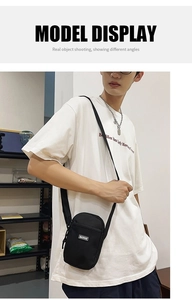 Close-up of black nylon mini crossbody bag with MACHUGE logo and adjustable strap