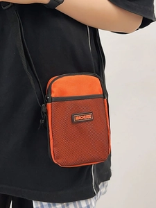 Bright orange and black nylon mini crossbody bag with MACHUGE logo and mesh pocket