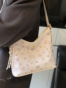 Bolso hobo blanco crema con estampados de garabatos marrones y borla lateral elegante