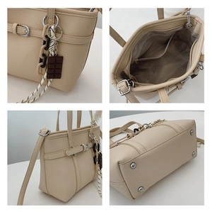 Detail views of beige litchi grain leather bucket bag with hardware and charms