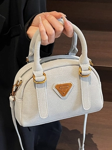 Minimalist light grey leather Boston handbag with gold metal logo and crossbody strap