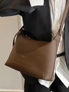 Minimalist brown lychee pattern leather tote bag with stylish decorative strap for women