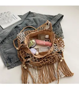 Detail of bohemian woven tote bag with fringe and drawstring inner pouch for essentials