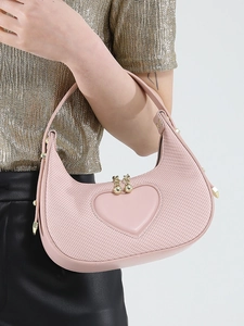 Pink heart-shaped crescent hobo bag with gold bead accents and textured fabric