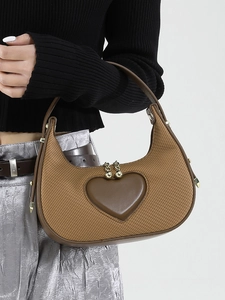 Brown woven hobo bag with leather heart detail and metallic studs for women