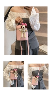 Pink lychee texture crossbody bag featuring a cute puppy plush charm and silver zipper detail