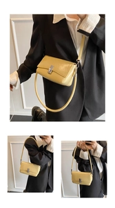 Close-up of yellow oil wax leather crossbody bag featuring a silver square metal buckle closure