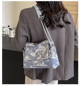 Blue and white landscape pattern tote bag with leather shoulder strap and chain detail