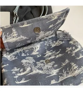 Close-up of the canvas tote bag showing the hidden magnetic clasp and landscape print