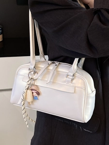 Minimalist cream white leather Boston shoulder bag with cute boy charm and long zipper
