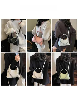 Chic bucket bag with lychee texture and silver chain shown in six vibrant color options
