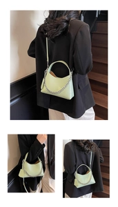 Macro detail of avocado green lychee texture bucket bag with silver metal chain decor