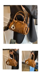 Brown bowling bag detail showing contrast stitching, side pockets, and pearl bear pendant
