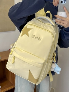 Sac à dos japonais en nylon jaune avec broderie d'étoiles et pendentif en peluche
