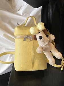 Yellow litchi grain mini handbag with a cute plush dog pendant for summer fashion style