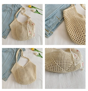 Detail of crochet tote bag with hollow knit pattern and floral embroidery scarf
