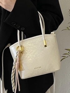 Chic white PU bucket bag with woven charm and gold hardware for office and daily wear