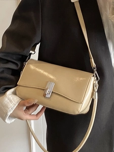 Elegant beige oil wax leather crossbody square bag with a silver metallic rotating clasp