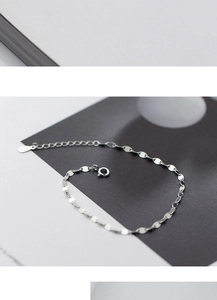 Detail shot of s925 silver geometric disc chain bracelet with adjustable water drop pendant