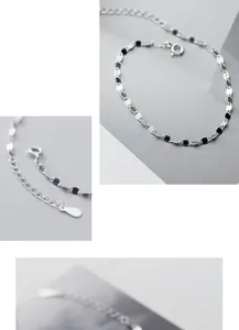 Detail view of S925 sterling silver chain bracelet with oval links and blue stones