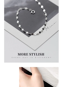 Macro detail of geometric S925 sterling silver chain bracelet with polished oval links