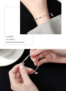 Detail of s925 silver bracelet with geometric olive shapes and teardrop pendant