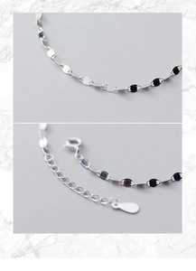 Macro detail of S925 sterling silver chain with lobster clasp and adjustable extension link