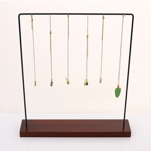 Creative necklace display stand with metal frame, wooden base, and six hanging hooks