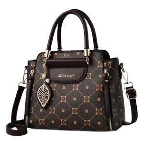 Elegant dark brown monogram leather handbag with golden leaf charm and shoulder strap
