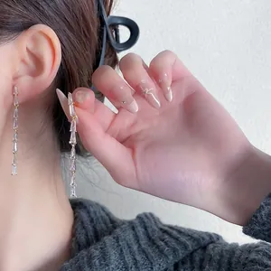 Elegant long tassel earrings with baguette-cut zircons for a minimalist luxury look