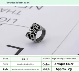 Detail view of vintage stainless steel Fuck Off ring weighing 2g with distressed finish
