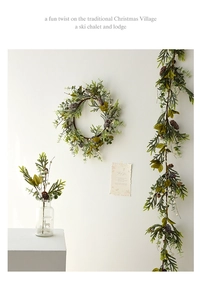 Close-up of Christmas wreath with pine cones and white berries for wall decoration